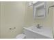Cozy bathroom features a white sink, toilet, and standard mirror at 7807 Napoleon St, Orlando, FL 32825