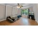Bright bedroom features a ceiling fan and a window with a view of the yard at 7807 Napoleon St, Orlando, FL 32825