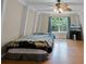 Bedroom features a window with natural light and a ceiling fan at 7807 Napoleon St, Orlando, FL 32825