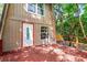 Close-up of the front exterior with a red wood deck, white door, and new windows at 7807 Napoleon St, Orlando, FL 32825