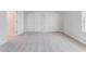 Bright bedroom featuring neutral walls, carpet and a closet at 9568 Starling Loop, Leesburg, FL 34788