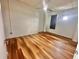 This bedroom features hardwood floors, bright white walls, and a ceiling fan at 10 N Summerlin Ave # 25, Orlando, FL 32801