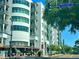 Modern condominium building featuring multiple stories, balconies, and street-level retail space at 10 N Summerlin Ave # 25, Orlando, FL 32801