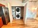 Convenient laundry closet including washer, dryer, and shelving for storage at 10 N Summerlin Ave # 25, Orlando, FL 32801