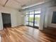 Bright living room area with wood floors and balcony access at 10 N Summerlin Ave # 25, Orlando, FL 32801