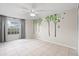 Bright bedroom with tree decal, neutral paint, tile floors, and large window allowing natural light at 11005 Cypress Leaf Dr, Orlando, FL 32825