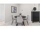 Cozy dining area with a modern table, four chairs, and a stylish accent cabinet at 11005 Cypress Leaf Dr, Orlando, FL 32825