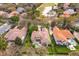 Aerial view of the property, showcasing the house, pool, and nearby golf course with lush landscaping at 11139 Camden Park Dr, Windermere, FL 34786