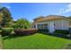 Large backyard showcasing meticulously maintained green lawn and verdant landscaping at 11139 Camden Park Dr, Windermere, FL 34786