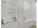 Modern bathroom with glass door shower, bench seating, and sleek white tile at 11139 Camden Park Dr, Windermere, FL 34786