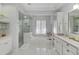Luxurious bathroom with walk-in shower, soaking tub, and dual sink vanity at 11139 Camden Park Dr, Windermere, FL 34786