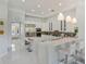 Modern kitchen featuring stainless steel appliances, white cabinets, and breakfast bar at 11139 Camden Park Dr, Windermere, FL 34786