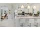Modern kitchen with stainless steel appliances, white cabinetry, and breakfast bar at 11139 Camden Park Dr, Windermere, FL 34786