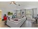 Spacious living room features a ceiling fan, hardwood floors, and plentiful natural light at 11139 Camden Park Dr, Windermere, FL 34786