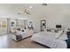 This main bedroom offers generous sitting and office space with hardwood floors and neutral decor at 11139 Camden Park Dr, Windermere, FL 34786
