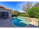 Inviting backyard pool area with lounge seating and mature landscaping on a sunny day at 11139 Camden Park Dr, Windermere, FL 34786