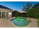 Backyard with a private pool, outdoor lounge area, and manicured landscaping at dusk at 11139 Camden Park Dr, Windermere, FL 34786