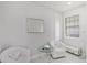 This relaxing sitting room features two chairs, marble floors, and abundant natural light at 11139 Camden Park Dr, Windermere, FL 34786
