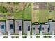 An aerial view showcasing the backyards, lawn, and layout of homes in the community at 11725 Language Way, Orlando, FL 32832