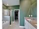 Bathroom features double vanity, walk in glass enclosed shower and a soaking tub at 11725 Language Way, Orlando, FL 32832