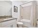 Bathroom showcasing a white vanity and bathtub with shower at 11725 Language Way, Orlando, FL 32832