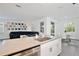 Open-concept kitchen features modern appliances and a seamless flow into the dining and living areas at 11725 Language Way, Orlando, FL 32832
