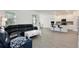 Cozy living area seamlessly connects to the modern kitchen and dining space at 11725 Language Way, Orlando, FL 32832