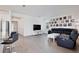 Open-concept living space featuring wood floors and views of modern kitchen at 11725 Language Way, Orlando, FL 32832