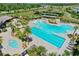 Aerial view of community pool with lap lanes, splash pad, spa, and lounge chairs at 11725 Language Way, Orlando, FL 32832