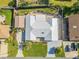 Aerial view of home's exterior, driveway, and landscaping at 120 Sand Dunes Dr, Ormond Beach, FL 32176