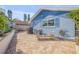 Backyard brick patio with garden and outdoor lounging area at 120 Sand Dunes Dr, Ormond Beach, FL 32176
