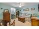 Charming bedroom with light blue walls, a patterned quilt, and vintage decor at 120 Sand Dunes Dr, Ormond Beach, FL 32176