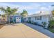 Landscaped exterior of this single Gathering home shows the garage and driveway at 120 Sand Dunes Dr, Ormond Beach, FL 32176