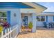 Charming front entrance featuring brick pavers and a covered porch at 120 Sand Dunes Dr, Ormond Beach, FL 32176