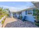 Inviting front porch featuring brick flooring and outdoor seating at 120 Sand Dunes Dr, Ormond Beach, FL 32176