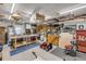 View of the interior of the garage with work space, tools and other storage equipment at 120 Sand Dunes Dr, Ormond Beach, FL 32176