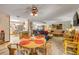 Open concept living and dining area with couches and wicker furniture at 120 Sand Dunes Dr, Ormond Beach, FL 32176