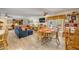 Open concept living room with comfortable couches and wicker furniture at 120 Sand Dunes Dr, Ormond Beach, FL 32176