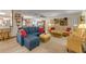 Open concept living room with comfortable couches and wicker furniture at 120 Sand Dunes Dr, Ormond Beach, FL 32176