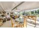 Inviting sunroom with ceiling fan and views of lush landscaping at 120 Sand Dunes Dr, Ormond Beach, FL 32176