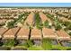 Wide aerial shot of a large neighborhood with manicured yards, tiled roofs, and screened in patios in Florida at 1405 Thunderbird Rd, Davenport, FL 33896