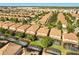 Expansive aerial view of a well-planned community with tiled roofs, pools, and lush landscaping in sunny Florida at 1405 Thunderbird Rd, Davenport, FL 33896