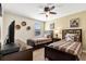 Comfortable bedroom featuring two twin beds, ceiling fan, and decorative wall art at 1405 Thunderbird Rd, Davenport, FL 33896