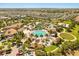 Wide aerial view of an amazing resort style community pool, landscaping, and outdoor recreational area at 1405 Thunderbird Rd, Davenport, FL 33896