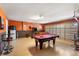 Spacious garage converted into a game room with a pool table and foosball table at 1405 Thunderbird Rd, Davenport, FL 33896
