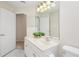 Bright bathroom featuring a vanity with plant decor, and open doorway at 14313 Roxshire Dr, Orlando, FL 32837