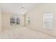 Spacious bedroom with vaulted ceilings and multiple windows for ample natural light at 14313 Roxshire Dr, Orlando, FL 32837