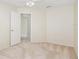 Bedroom with neutral carpeting and walls with an open doorway for easy access at 14313 Roxshire Dr, Orlando, FL 32837