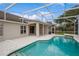 The home boasts a pristine screened-in pool, patio and serene outdoor space at 14313 Roxshire Dr, Orlando, FL 32837