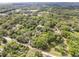 Expansive wooded property viewed from above, offering a private retreat in a convenient location at 145 Baywood Dr, Oak Hill, FL 32759